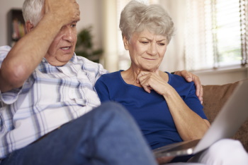 Confused couple trying to learn about elder care options.