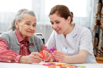 Woman with Alzheimer's disease and nurse