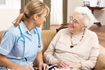 Elder care person with senior lady.