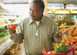 Elderly man wearing a medical alert pendant