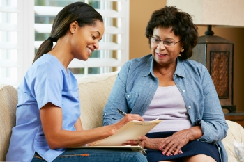 Home health nurse with patient.