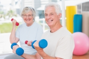 Senior man and woman exercising